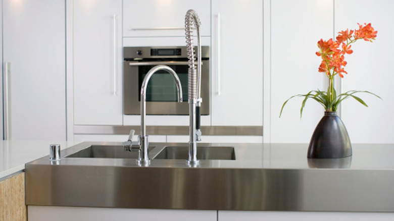View of modern kitchen with stainless steel counter