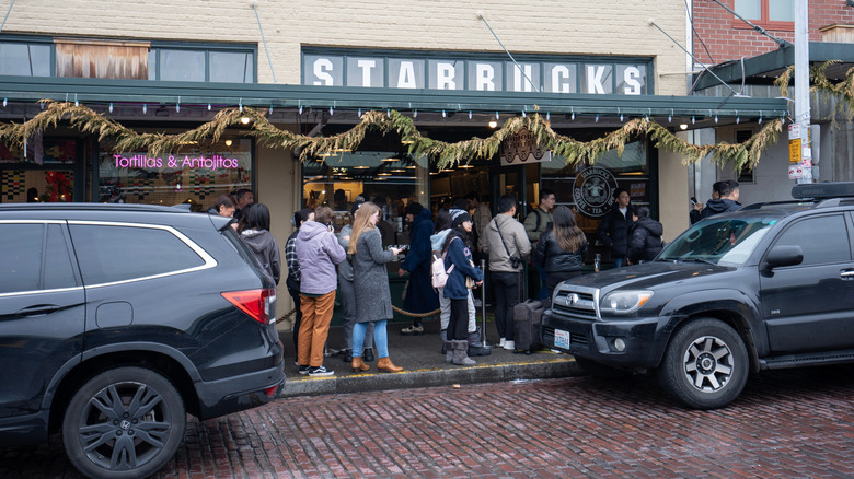 Customers lined up outside of Starbucks