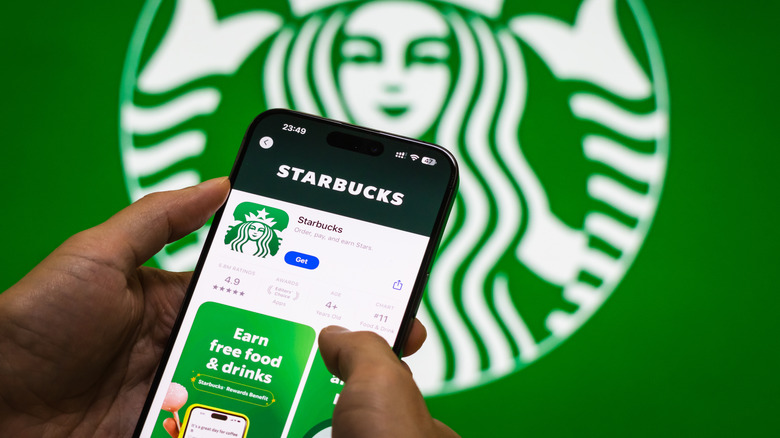 Phone with Starbucks app on the screen