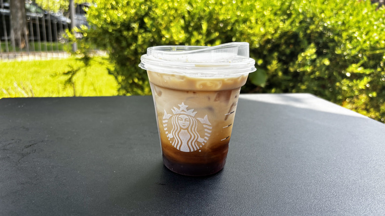 Hazelnut oatmilk shaken espresso in a to go cup