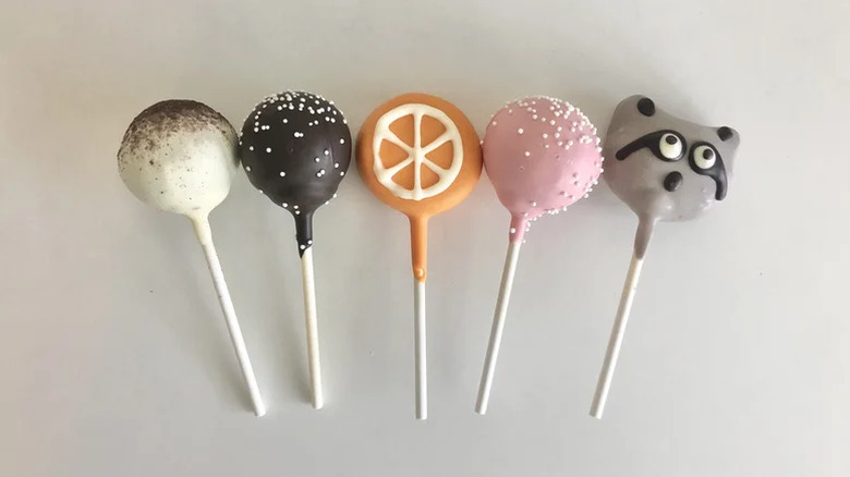 Five different Starbucks cake pops against a white background