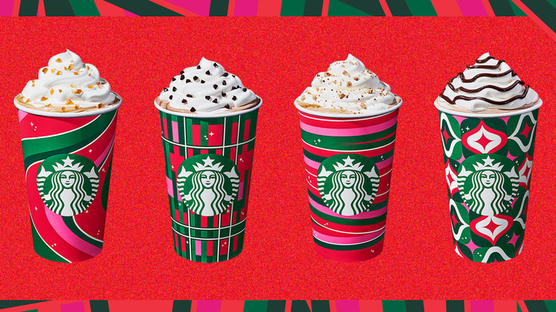 Row of new Starbucks holiday cups with festive drinks 