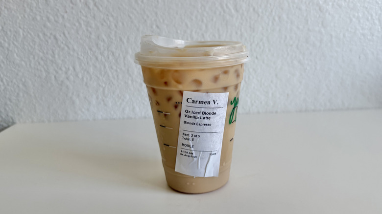 Starbucks blonde vanilla iced latte in a plastic cup