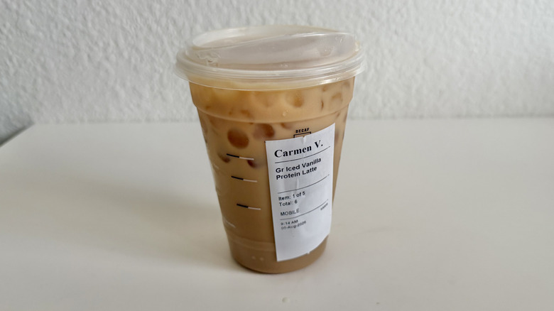 Vanilla protein iced latte in a plastic cup