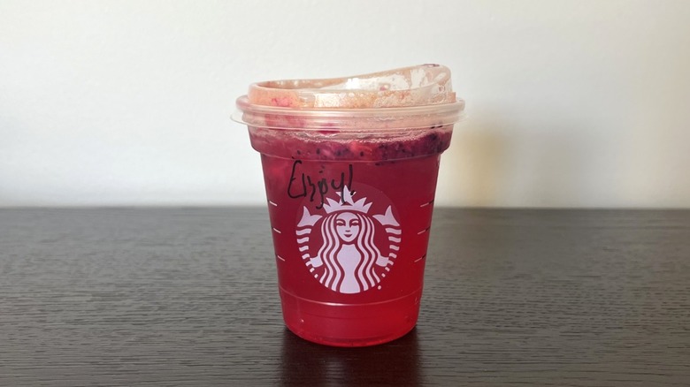 Starbucks Mango Strawberry Refresher in to-go cup.