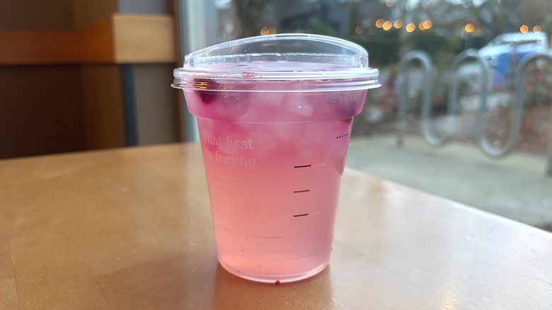Starbucks Pink Cannon Ball Drink on table in cafe