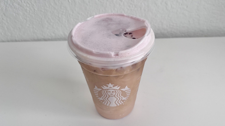 White Chocolate Strawberry Cream Cold Brew drink on table