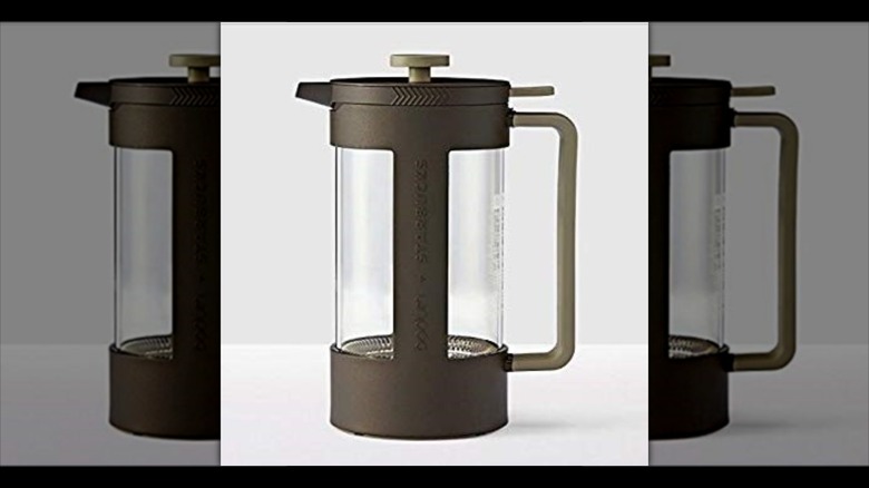 Mirrored image of coffee press against white background