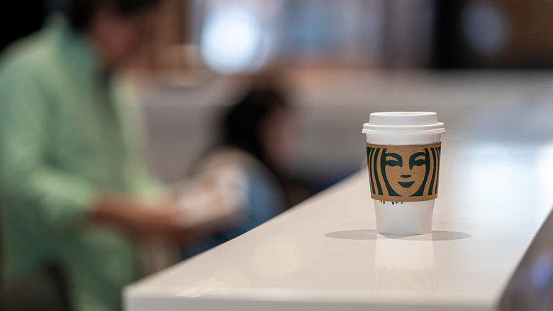 Starbucks cup on counter