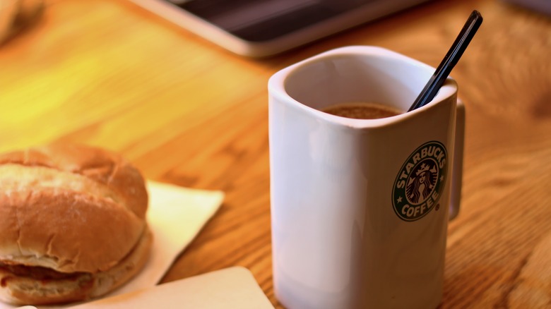 Starbucks mug on meeting table