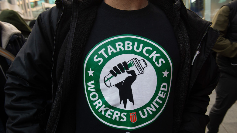 man in Starbucks union shirt
