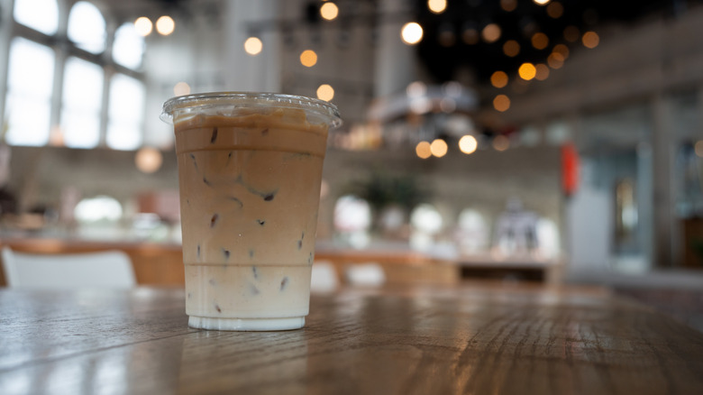 Iced vanilla latte on table