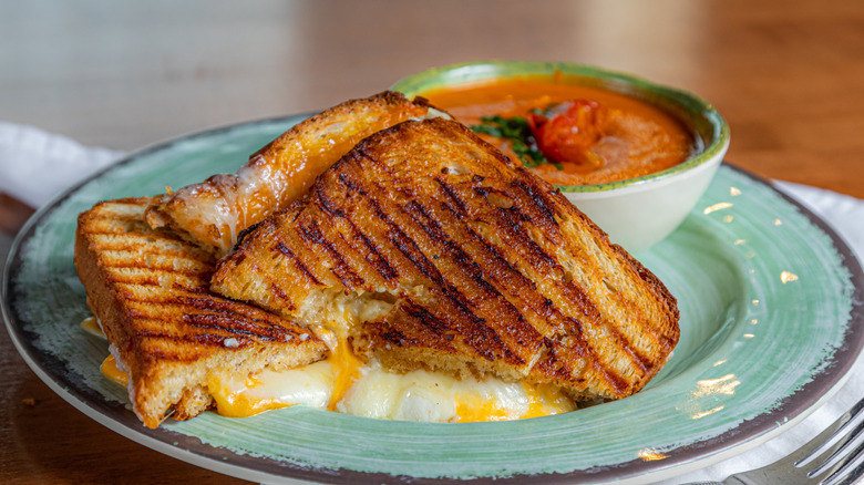 Homemade grilled cheese sandwich with tomato soup