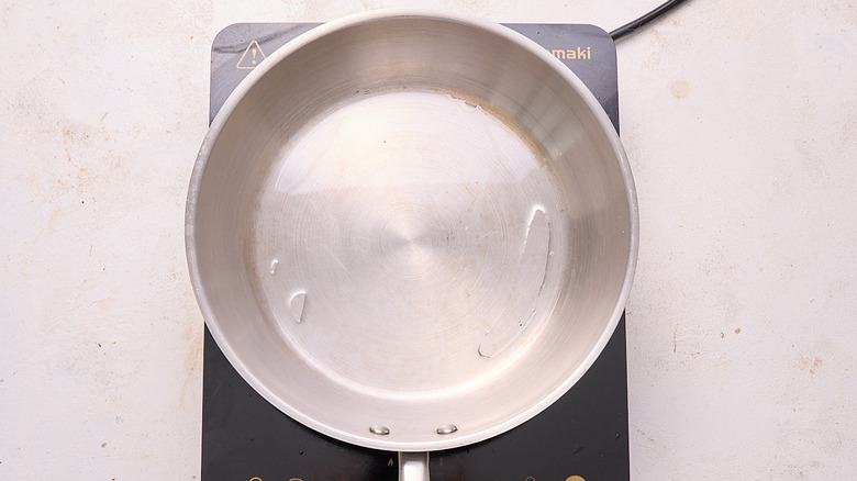 heating oil in a skillet