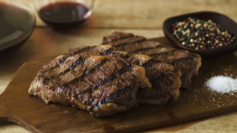 Medium-well steaks on a cutting board