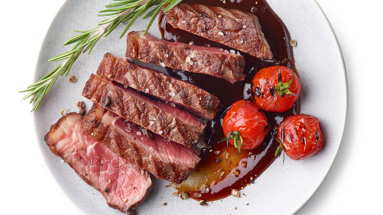 Sliced rare steak on a plate