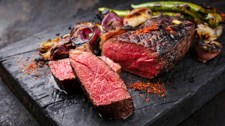 Rare steak sliced on a cutting board