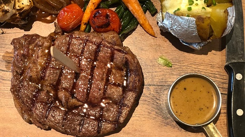 Steak with cupful of gravy