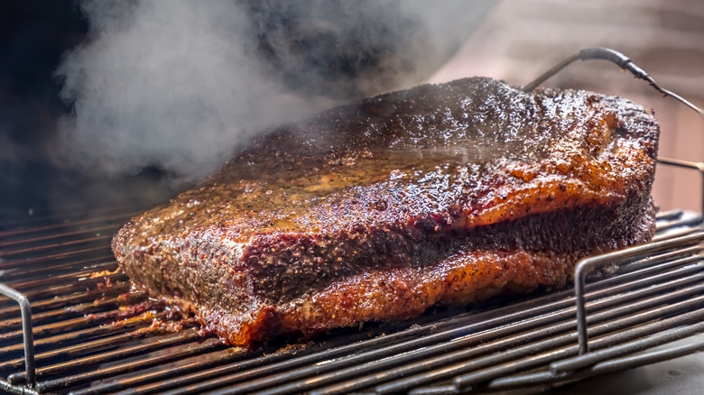 Charred steak on grill