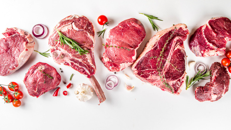 An assortment of raw steaks
