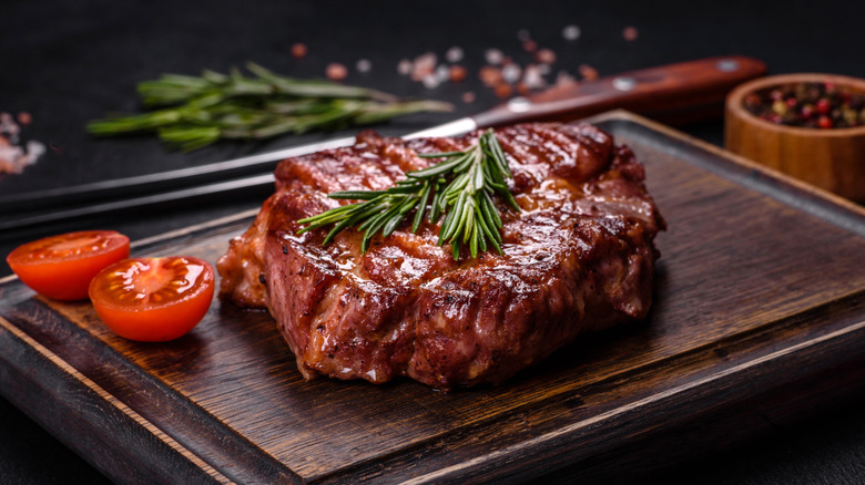grilled steak on cutting board