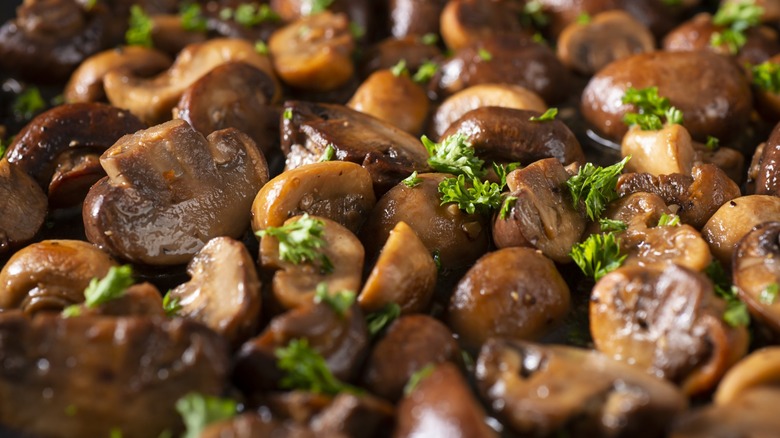Close-up of cooked mushrooms and parsley