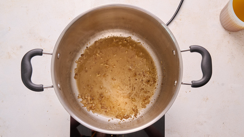 cooking sherry and garlic in a pot