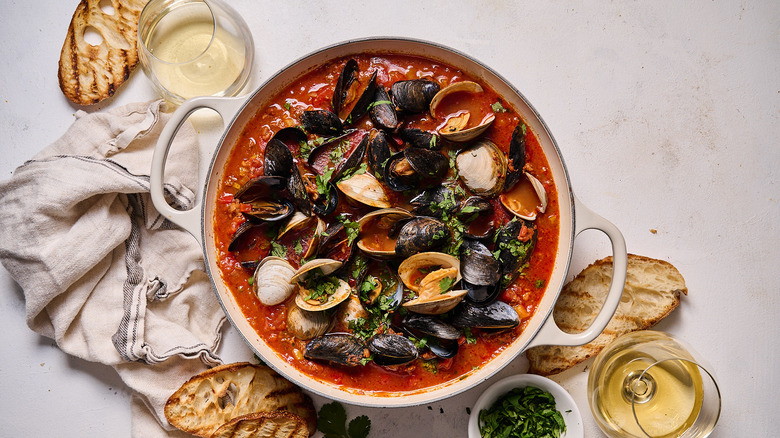 mussels and clams in chorizo broth with wine and toasted bread
