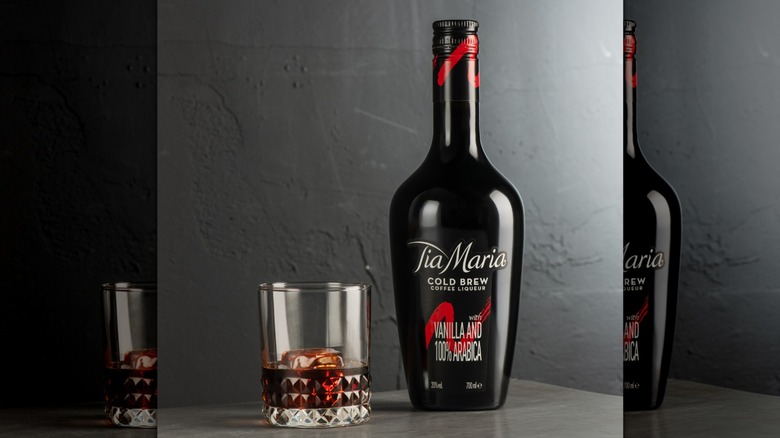 Bottle and glass of Tia Maria on table