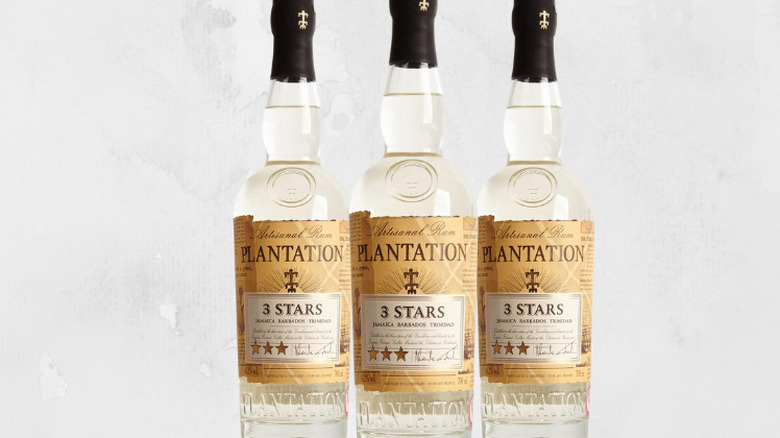 Three bottles of Plantation 3 stars rum against a white background.