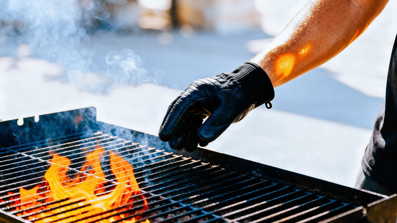 Person heating up a grill