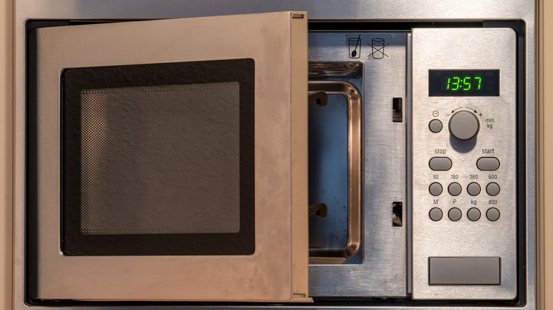 Microwave door open with nothing inside