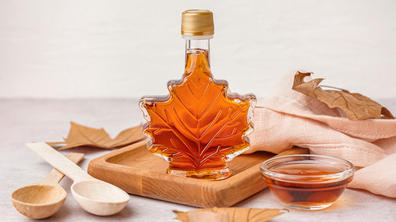 A maple leaf shaped bottle of maple syrup