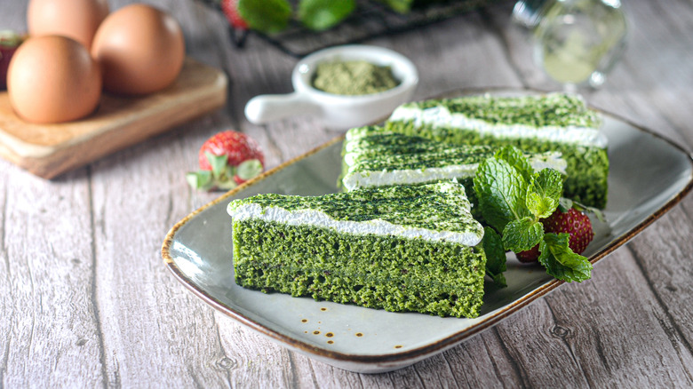 layered matcha cake on a plate