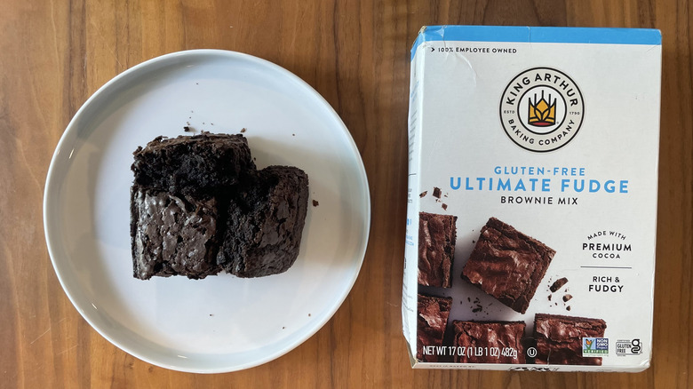 King Arthur brownie mix box and baked brownies on a plate