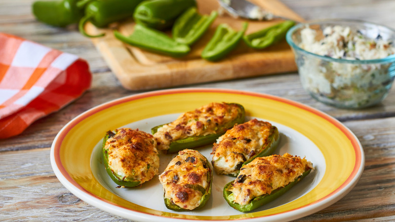 Plate of jalapeno poppers next to ingredients