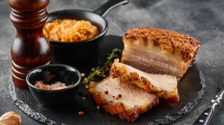 crispy pork belly with salt and pepper shaker