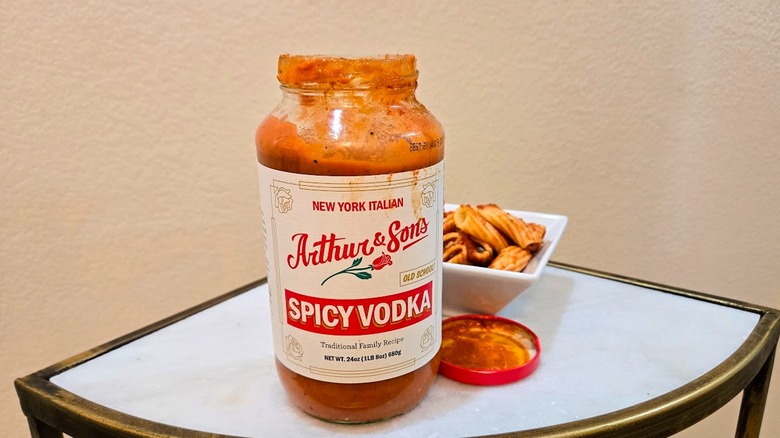 Arthur & Sons spicy vodka sauce jar by pasta dish