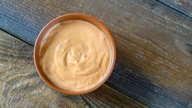 Bowl of yum yum sauce on a wooden table