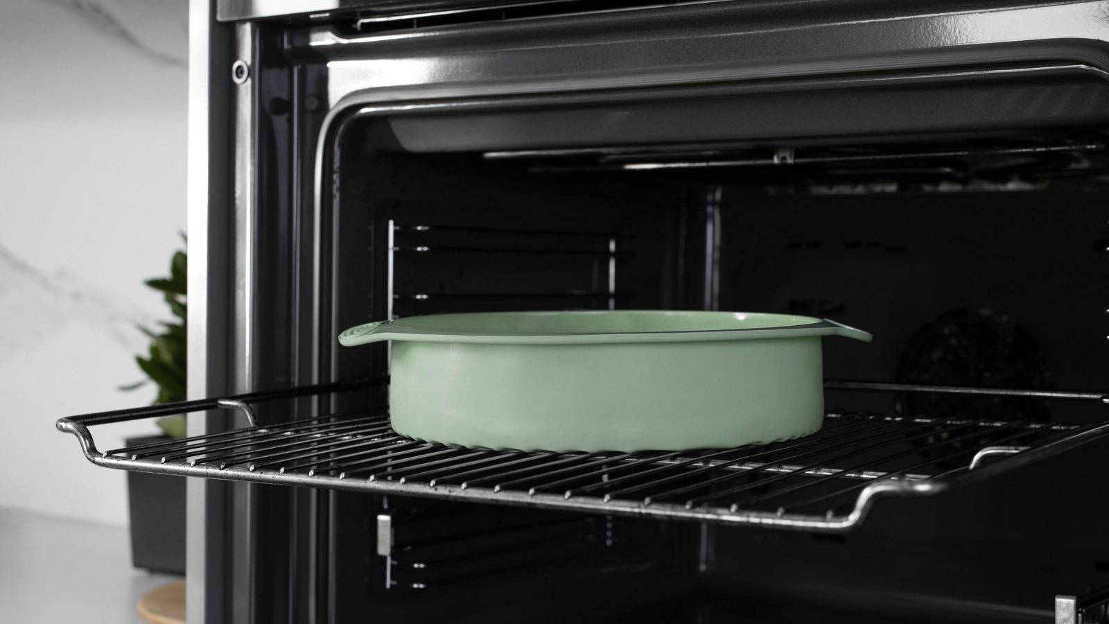 The Crucial Safety Step You Can't Skip When Storing Extra Pans In The Oven