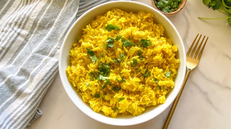 yellow rice in white bowl