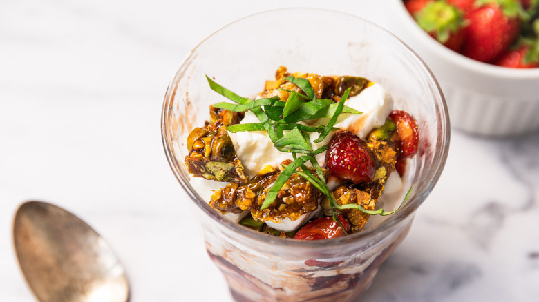 One Strawberry Balsamic Sundae on table with toppings