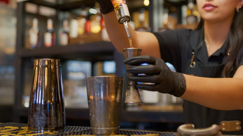 woman mixing cocktail