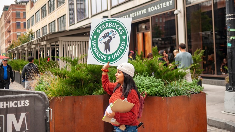 woman with Starbucks union sign