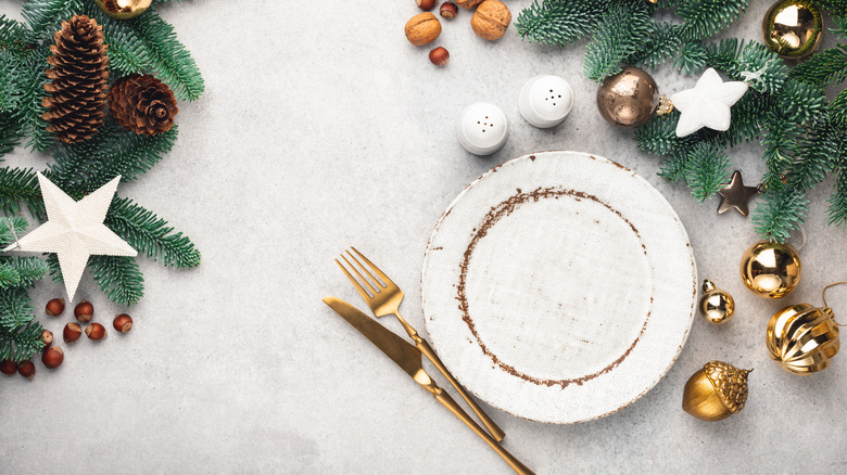 Plate, cutlery, and holiday decorations