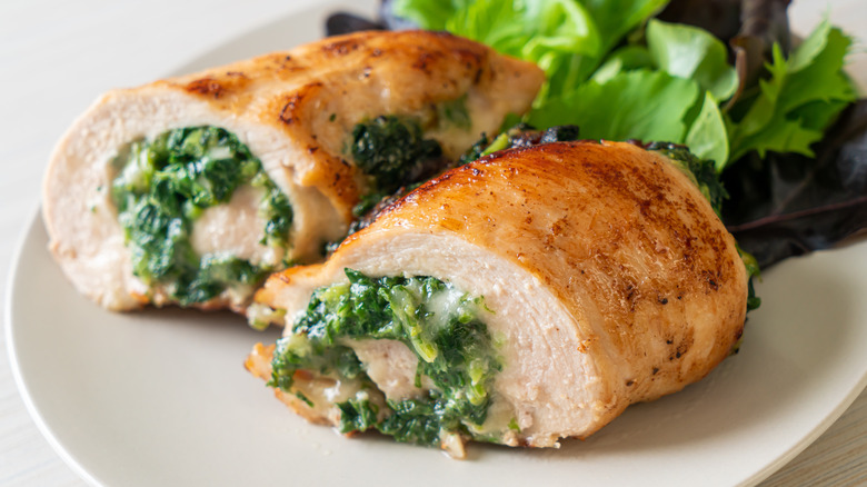 Chicken stuffed with spinach on plate 