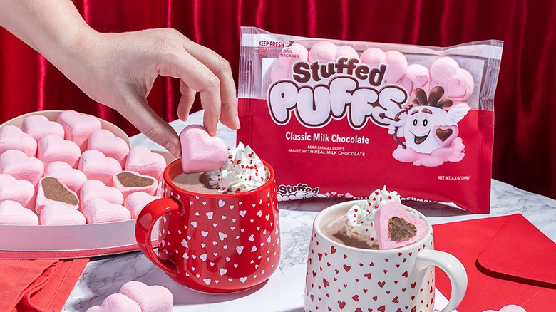 mugs of hot cocoa with stuffed puffs 