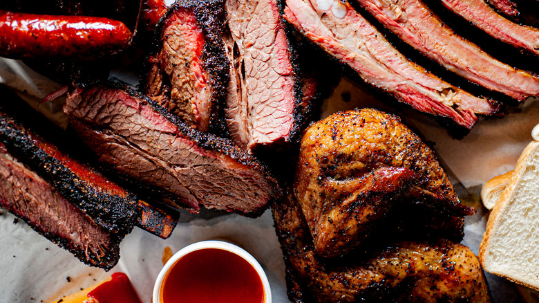 bbq plate with various meats and sauce