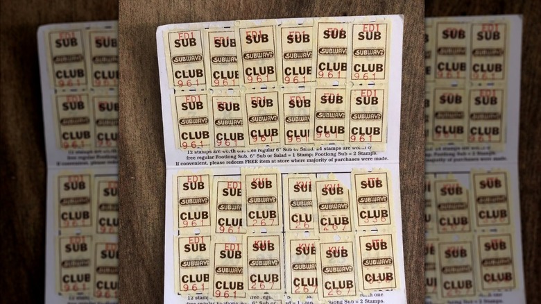 Mirrored image of old Sub Club card with stickers