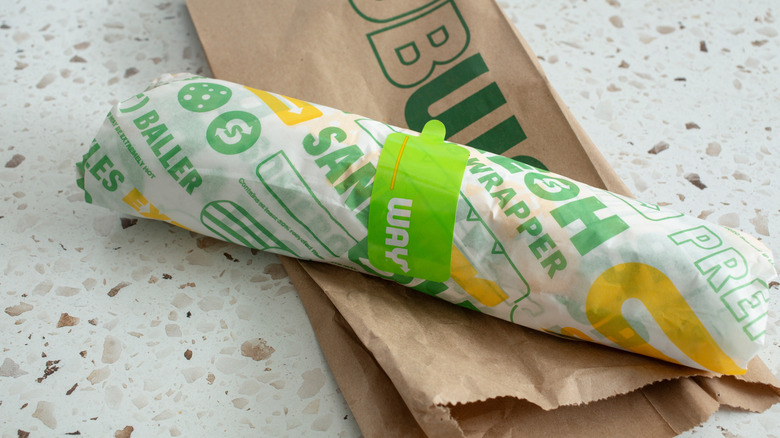 Top view of a wrapped Subway sandwich on a table